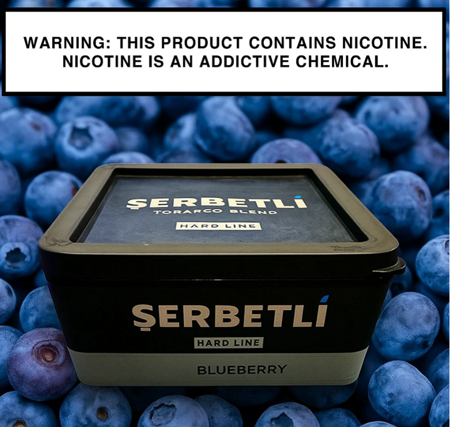 Serbetli Blueberry tobacco blend packaging surrounded by blueberries with a nicotine warning label.